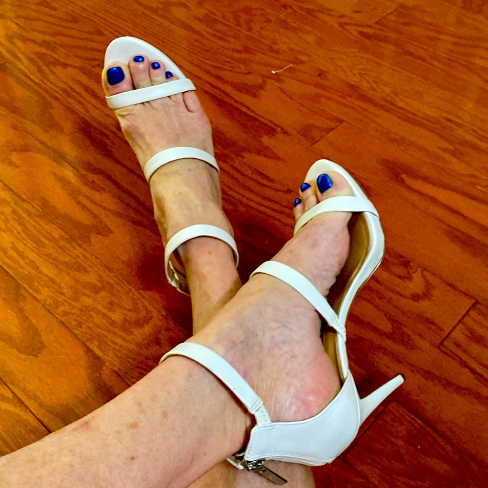 White zip closure INC high heals.  Size 7 1/2
